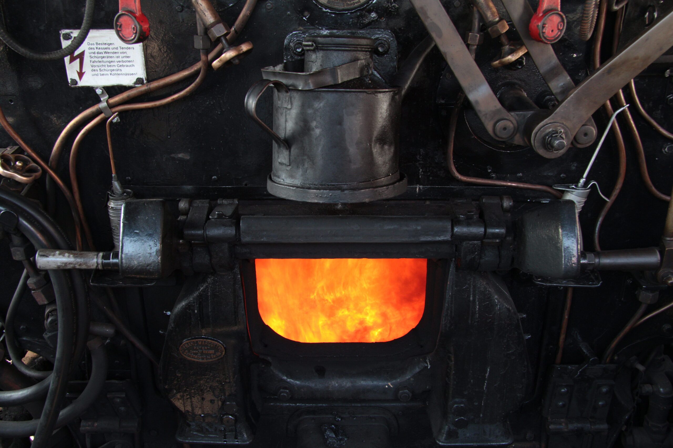 Fireman (stoker) at work in a steam locomotive