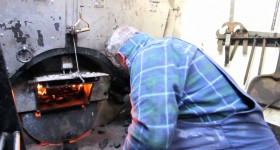 Shoveling coal in the boiler
