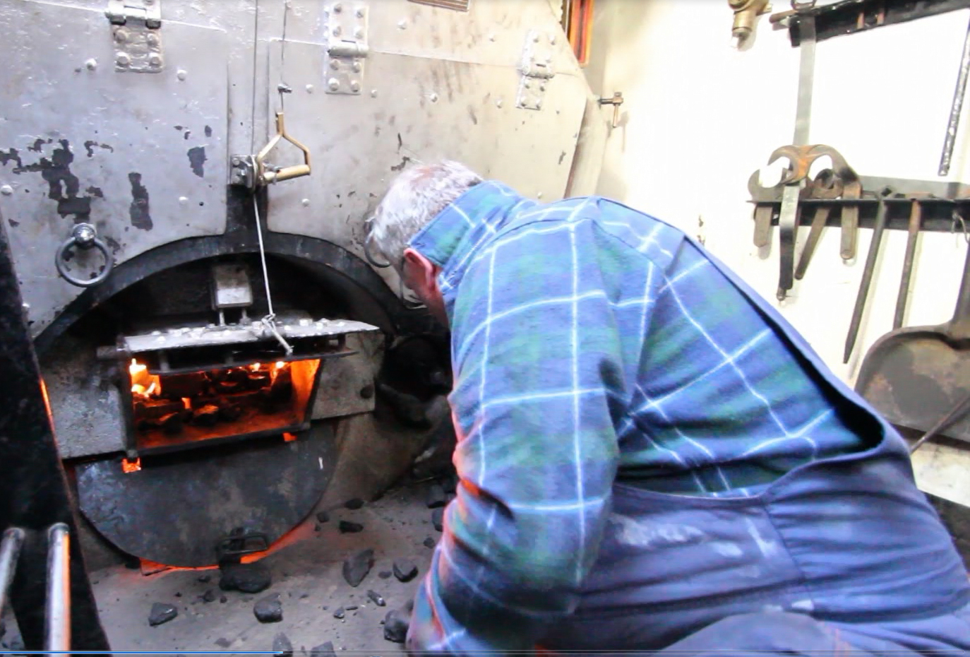 Shoveling coal in the boiler
