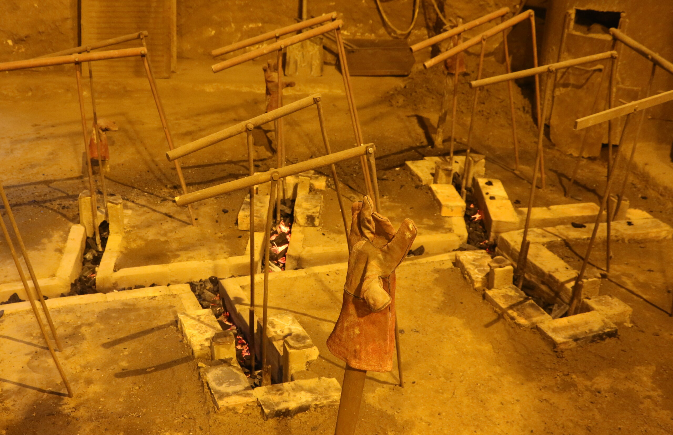 Bell foundry - warming up a drainpipe before casting a bell