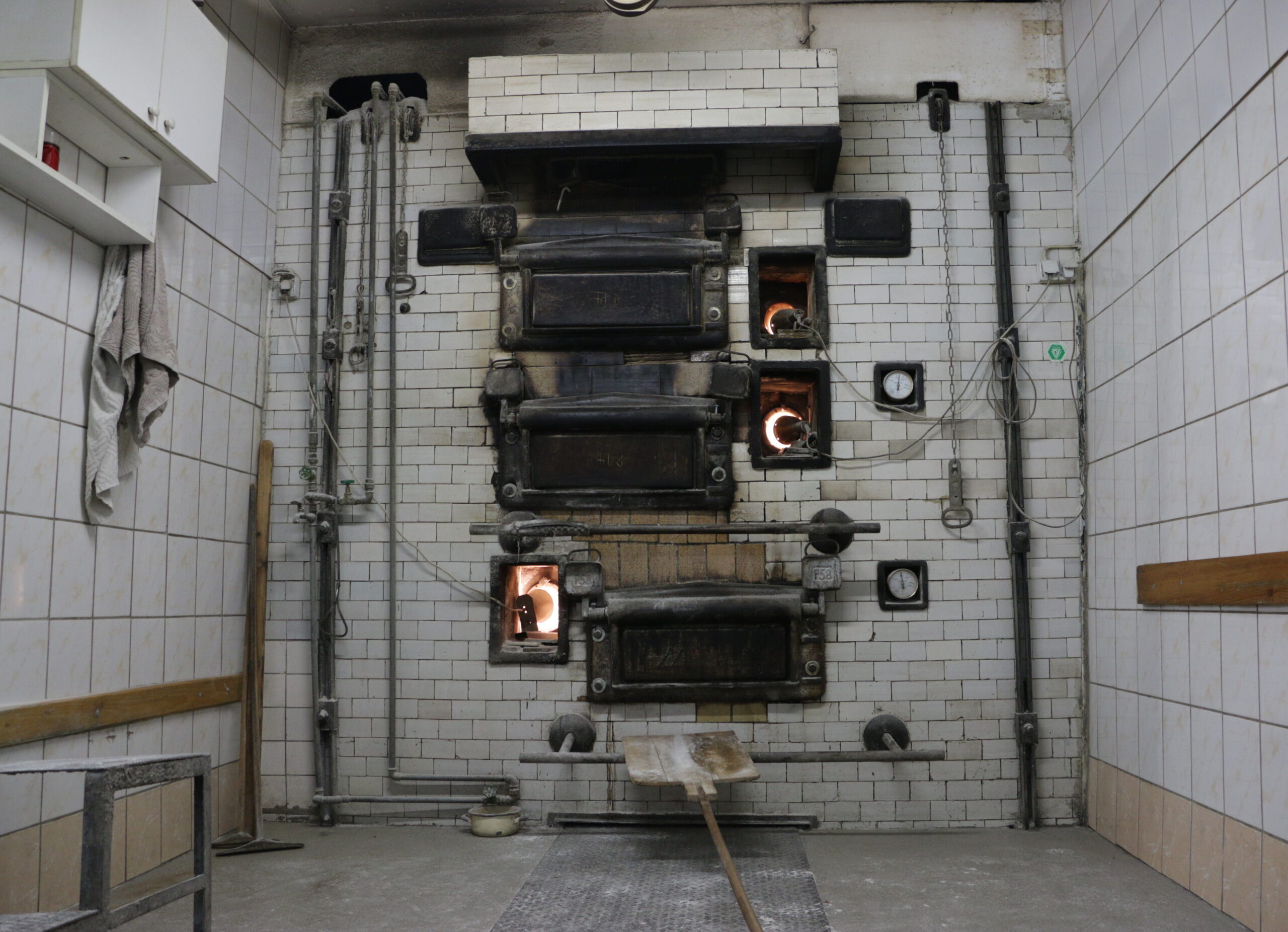 Bakery: putting bread into the bread oven (4)