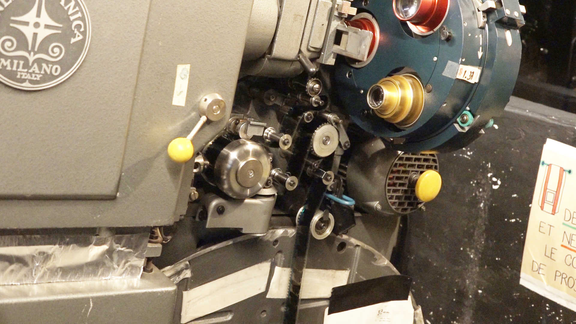 Projectionist turns the machine by hand - Cinema projector