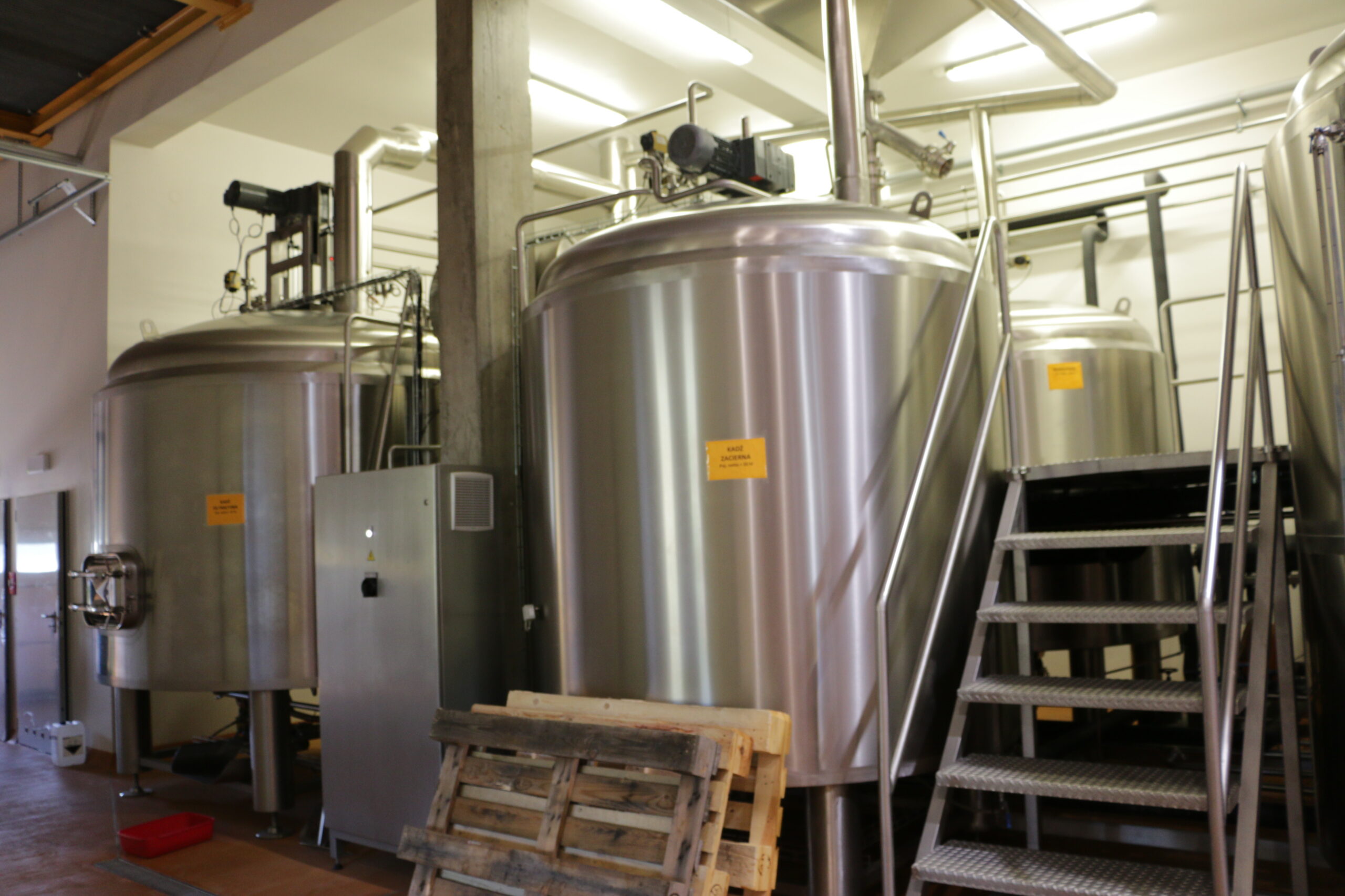 Brewery: pouring malt into a mash tun (3)