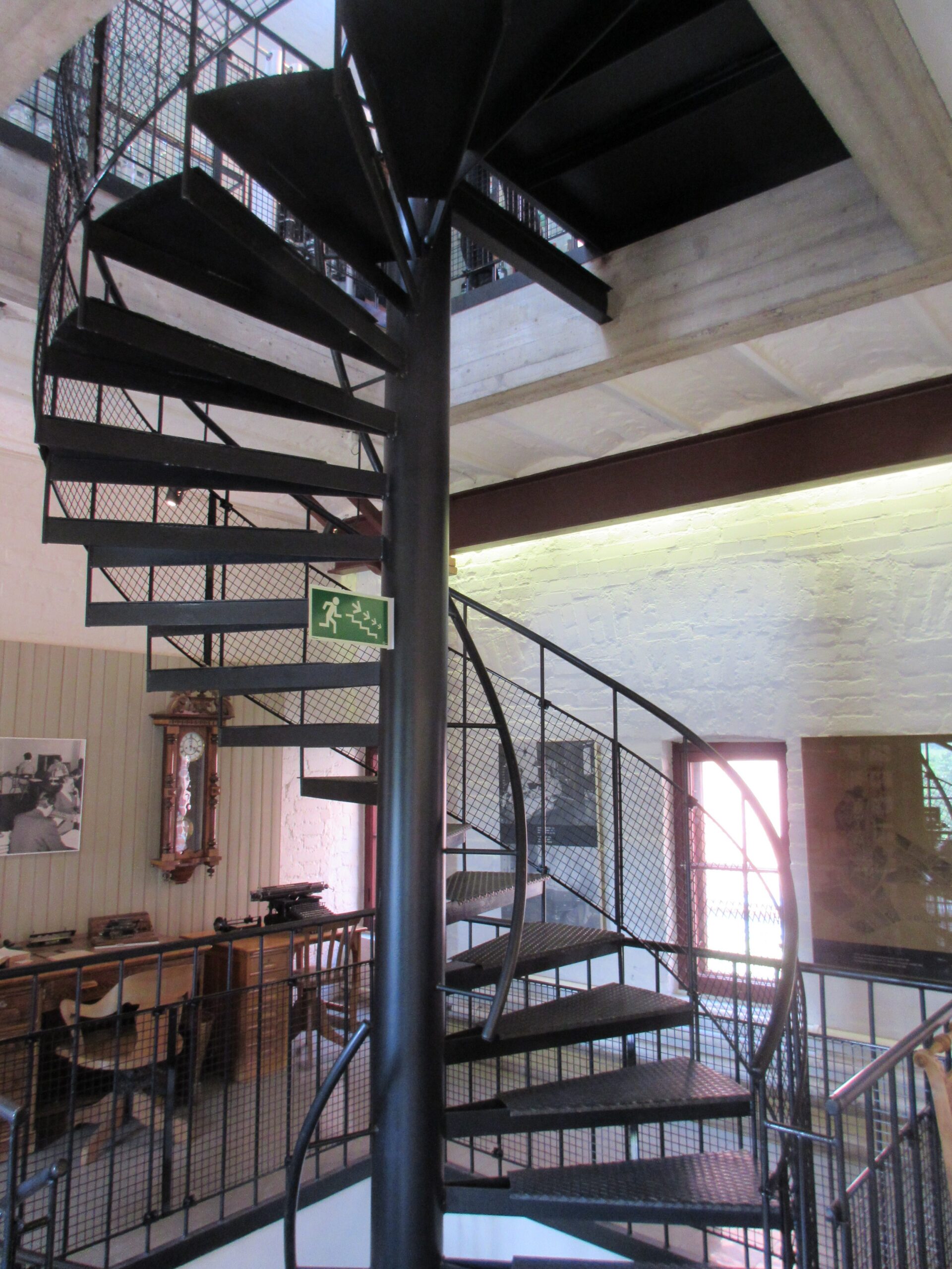 Climbing the metal stairs up at Alcoholic beverage plant in Rajamäki (Rajamäen Ryyppi -museum)